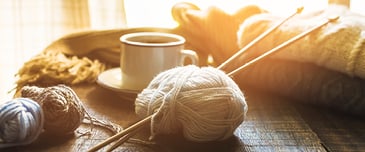 Close up coffee cup and knitting