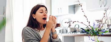 Woman sneezing