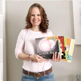 Michelle holding her ‘Allergy Books for Kids’