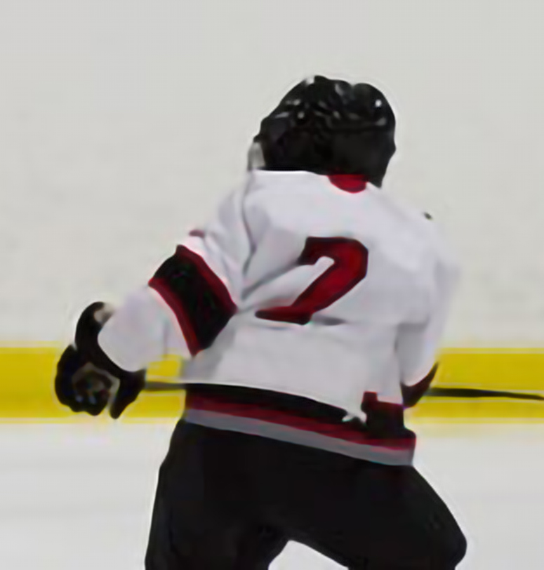 Back of a hockey player skating