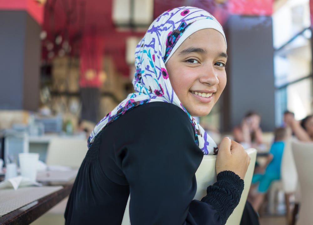 Happy Muslim family in restaurant Happy Muslim family in restaurant