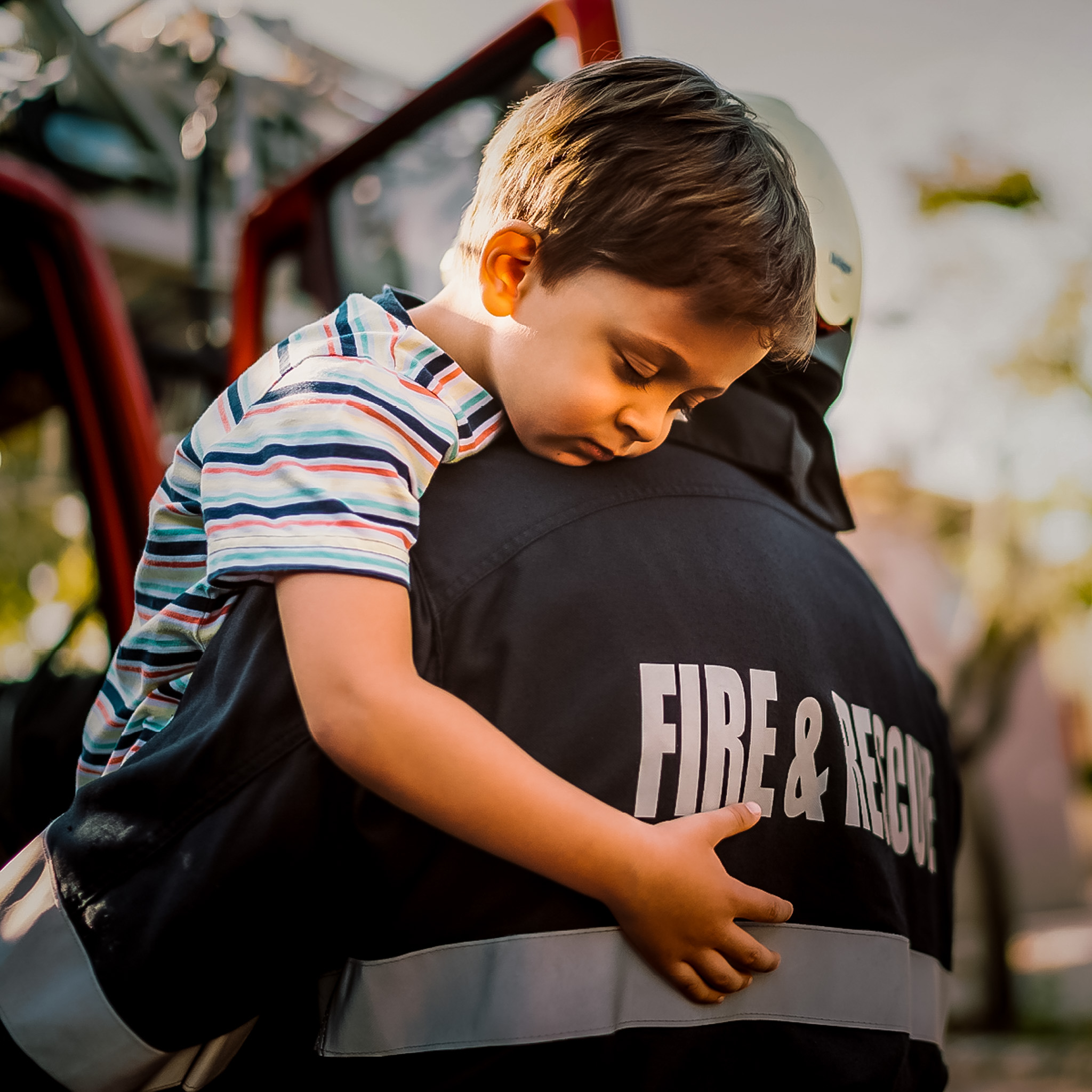 child with firefighter