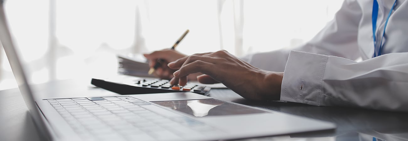 Person checking medical file on computer